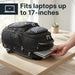 A hand sliding a laptop into the dedicated laptop compartment of the Targus Drifter backpack, which is lying on a wooden desk. Text reads 